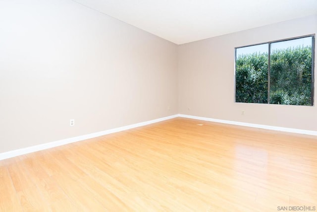 spare room featuring light wood-type flooring