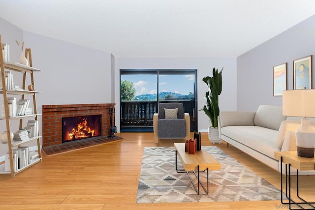 living room featuring a fireplace and hardwood / wood-style flooring