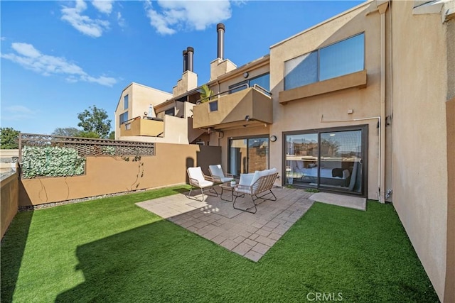 back of house with a patio and a yard