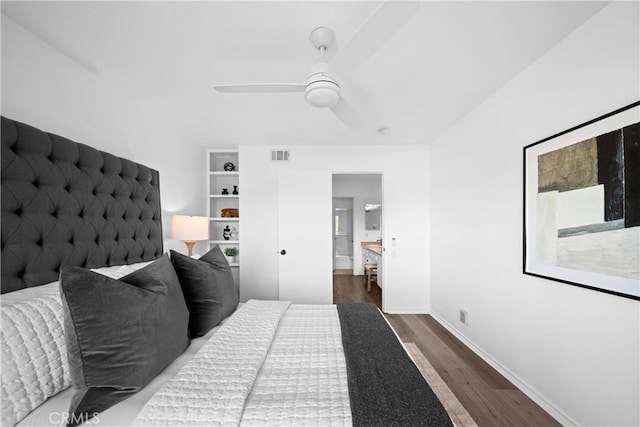 bedroom with dark hardwood / wood-style floors and ceiling fan