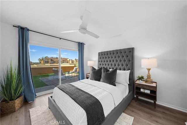 bedroom with hardwood / wood-style floors, access to outside, and ceiling fan