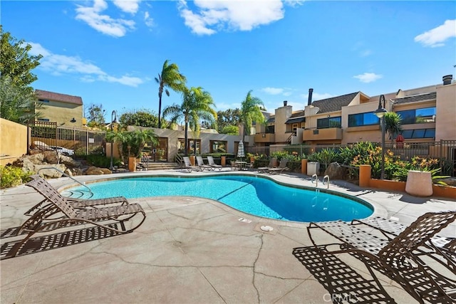 view of swimming pool with a patio area