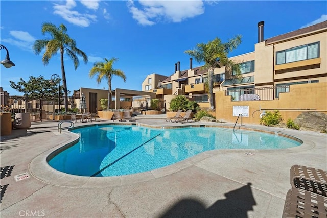 view of pool featuring a patio