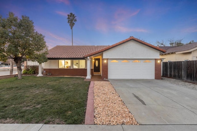 view of front facade featuring a yard and a garage