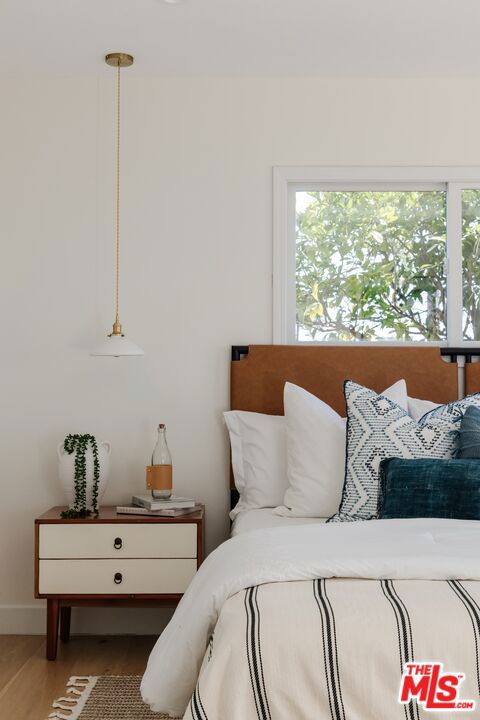 bedroom featuring wood-type flooring