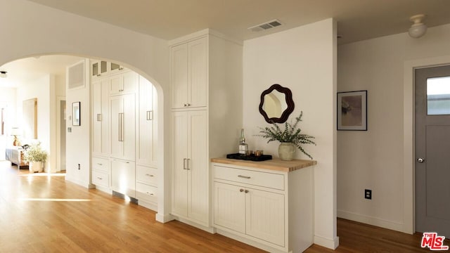 hallway with light hardwood / wood-style flooring