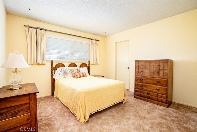 carpeted bedroom with a textured ceiling