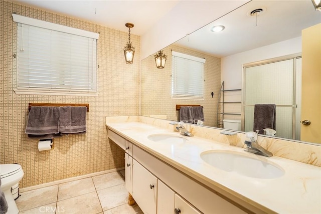 bathroom featuring tile patterned flooring, vanity, and toilet