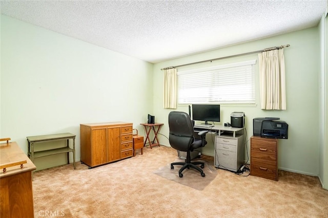 office featuring a textured ceiling and light colored carpet