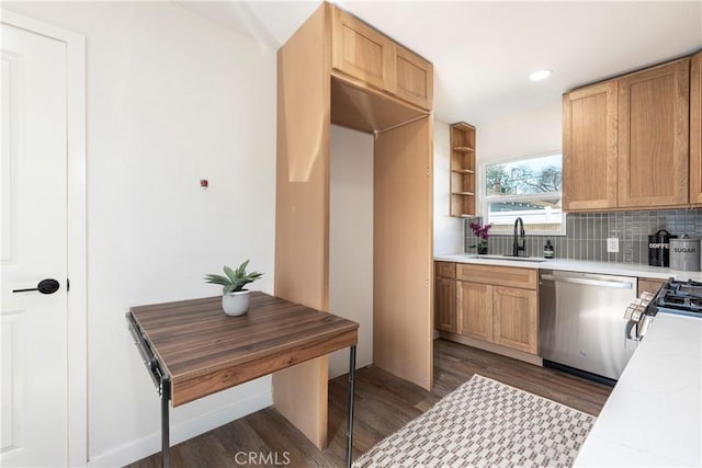 kitchen with stainless steel dishwasher, dark hardwood / wood-style floors, sink, and decorative backsplash