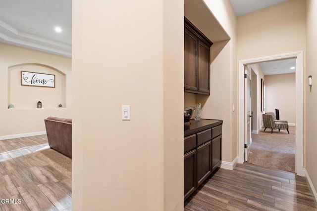 hallway featuring dark wood-type flooring