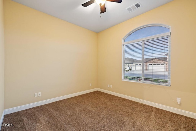 carpeted empty room with ceiling fan