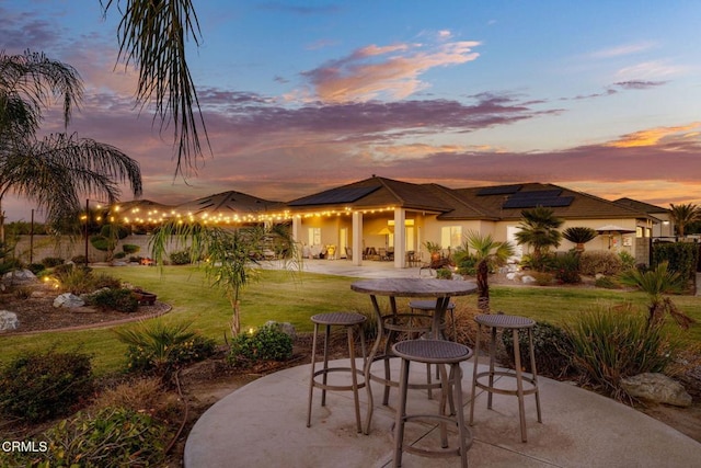 patio terrace at dusk with a lawn