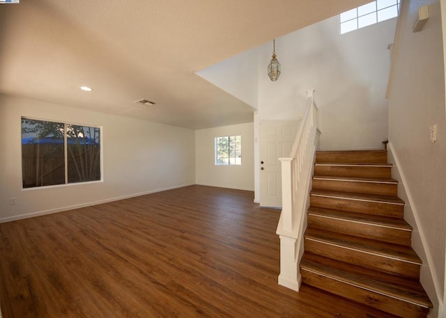 staircase featuring hardwood / wood-style floors