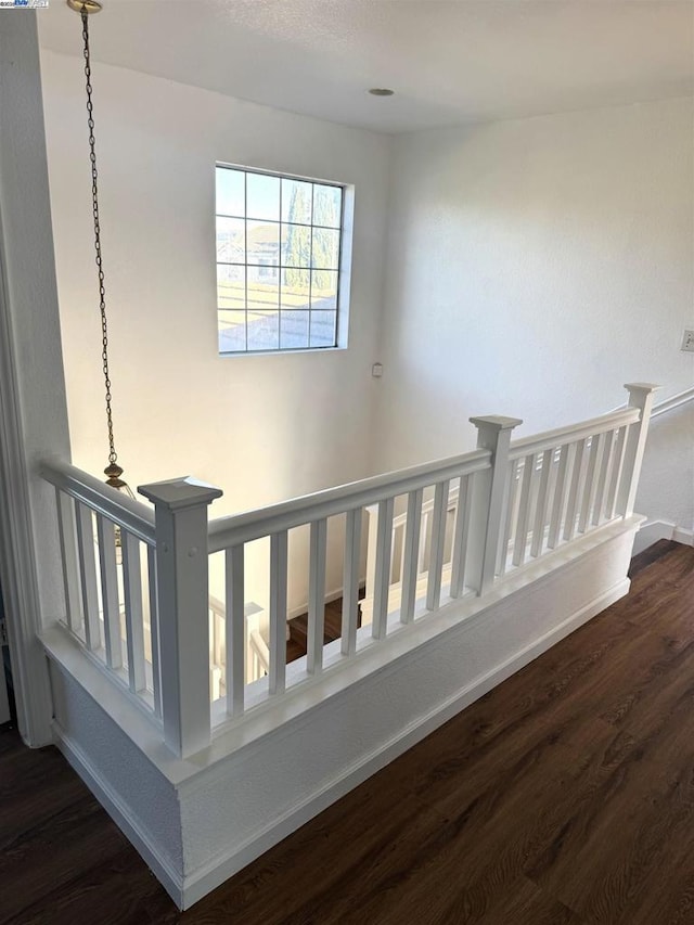 staircase featuring hardwood / wood-style flooring