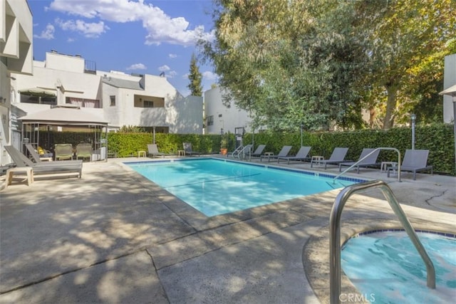 view of swimming pool with a patio