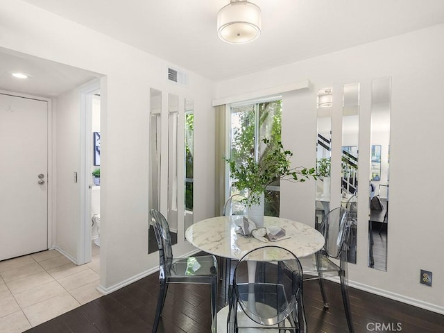 dining room with hardwood / wood-style flooring