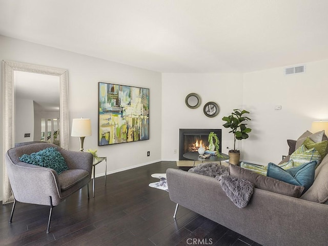 living room featuring dark wood-type flooring