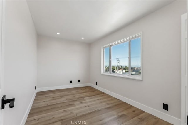 laundry room featuring light hardwood / wood-style floors