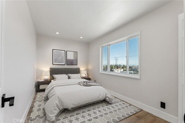 bedroom with wood-type flooring