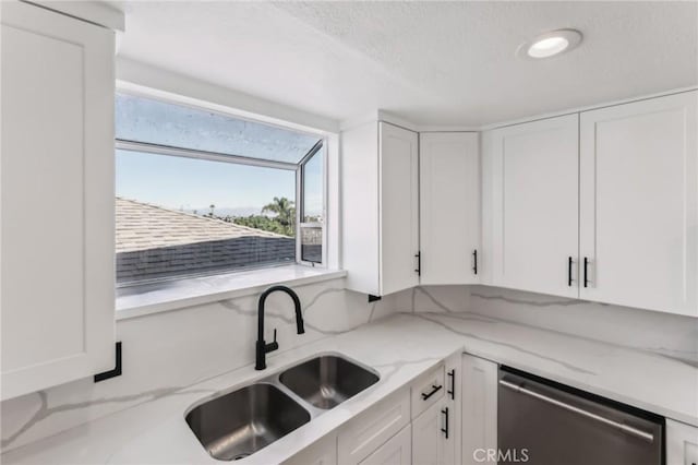 kitchen with white cabinetry and dishwasher