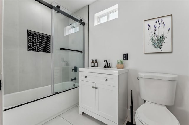 full bathroom with toilet, bath / shower combo with glass door, tile patterned floors, and vanity