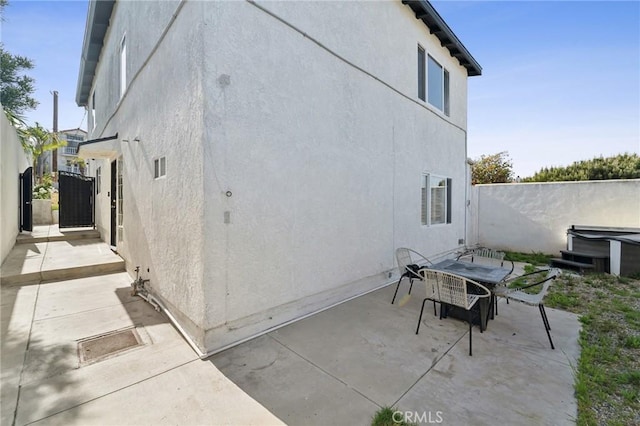 1536 Wollacott St, Redondo Beach, CA 90278 - view of home's exterior featuring stucco siding, a patio, fence, and outdoor dining area
