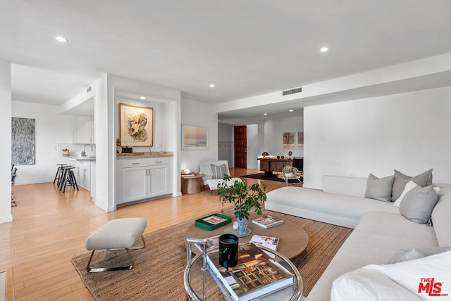 living room with light hardwood / wood-style floors