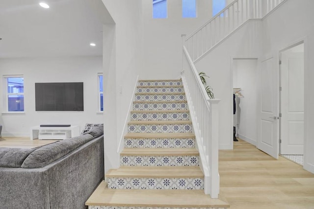 stairway featuring hardwood / wood-style floors