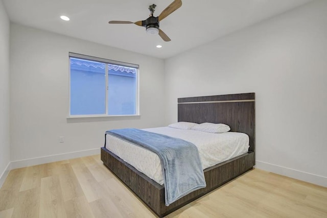 bedroom featuring ceiling fan and light wood-type flooring