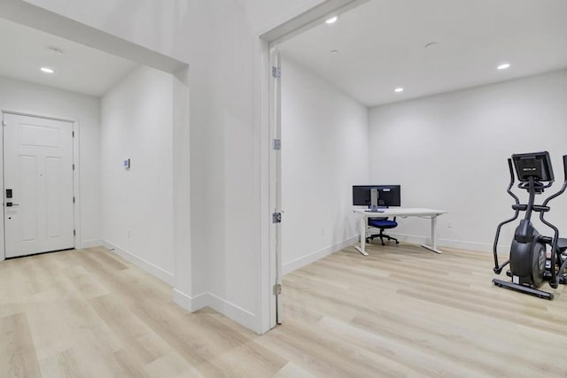 workout area featuring light hardwood / wood-style flooring