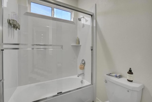 bathroom with toilet and enclosed tub / shower combo