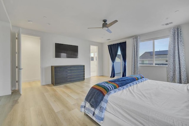 bedroom with light wood-type flooring and ceiling fan