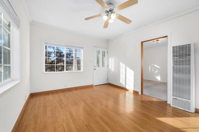 unfurnished room featuring light wood-type flooring, ceiling fan, and crown molding