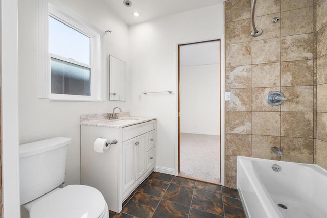 full bathroom with toilet, tiled shower / bath combo, and vanity