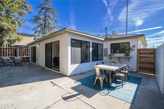 rear view of house with a patio