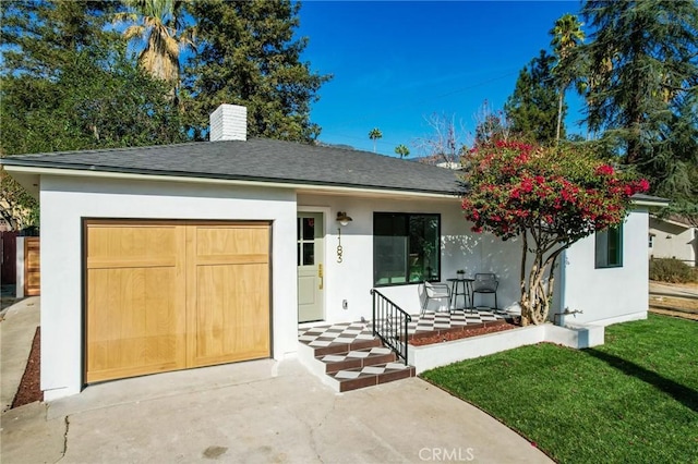 view of front of house featuring a garage and a porch