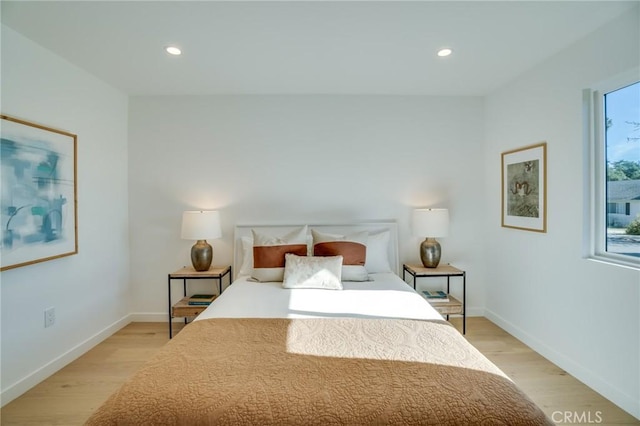 bedroom with light hardwood / wood-style flooring