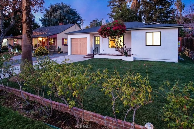 ranch-style home featuring a front yard and a garage