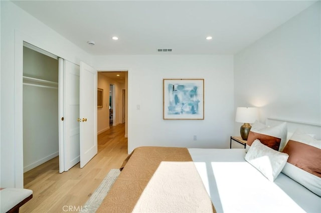 bedroom featuring a closet and light hardwood / wood-style floors