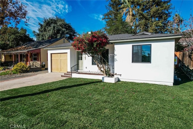 ranch-style home with a garage and a front yard