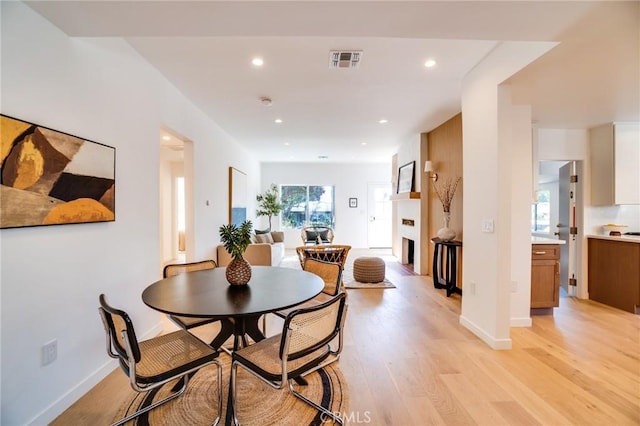 dining area with light wood-type flooring