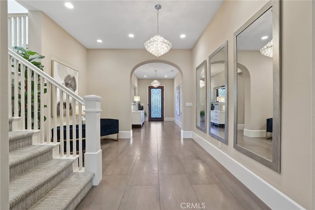 foyer featuring a notable chandelier