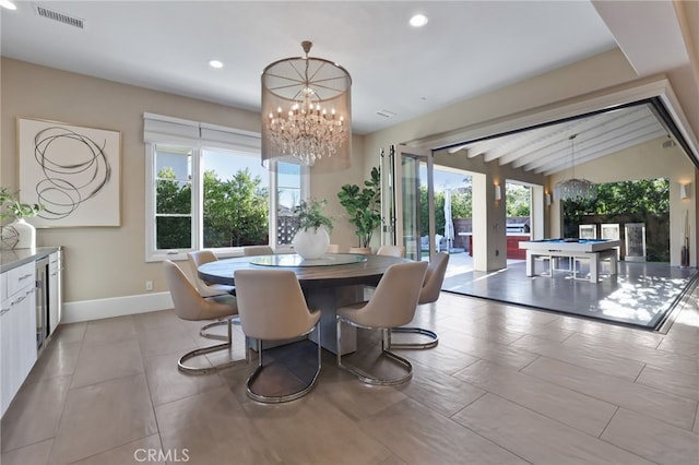 dining area featuring pool table, a notable chandelier, and lofted ceiling