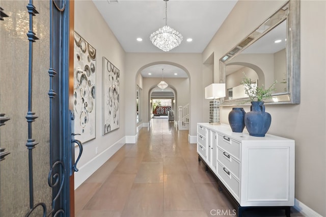 entrance foyer with an inviting chandelier