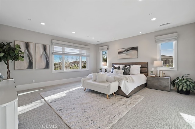 bedroom featuring light carpet