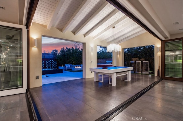 playroom with pool table, an inviting chandelier, and lofted ceiling with beams