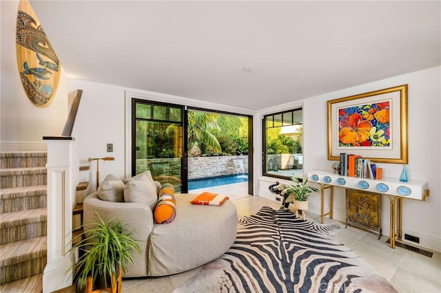 sitting room with floor to ceiling windows