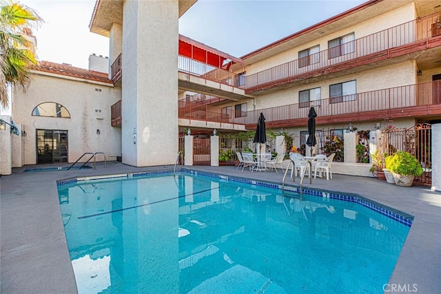 view of pool featuring a patio area