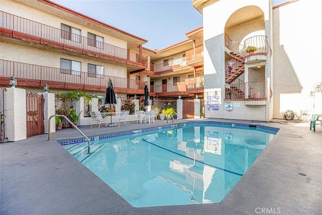 view of swimming pool featuring a patio area